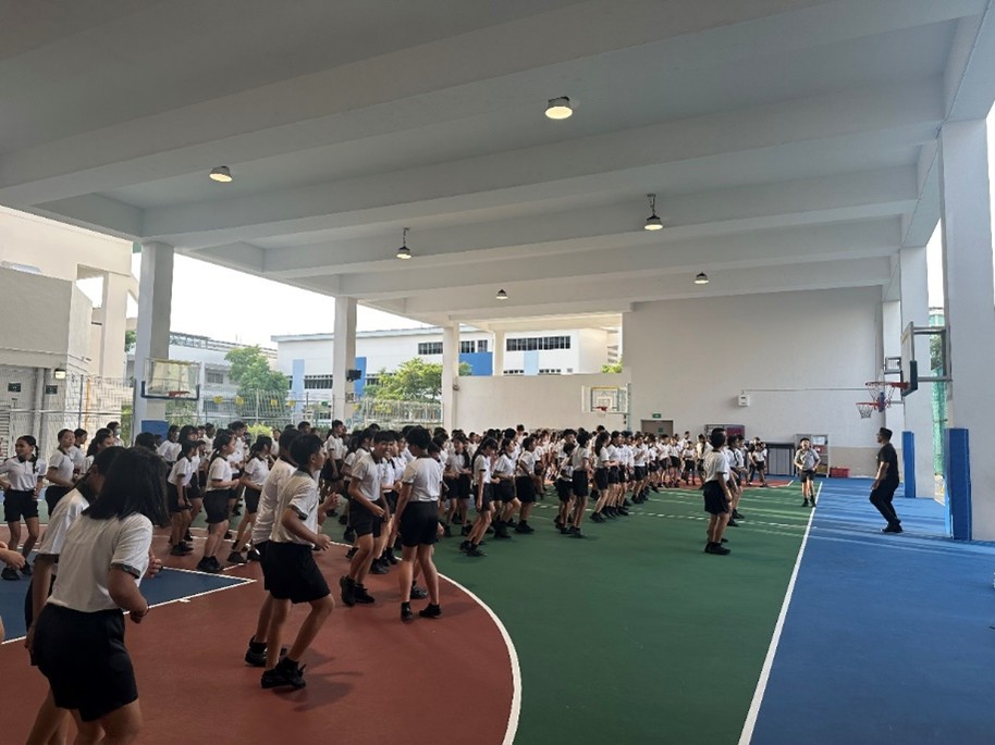 Our PE teacher, Mr Azrin, leading everyone in the warm-up