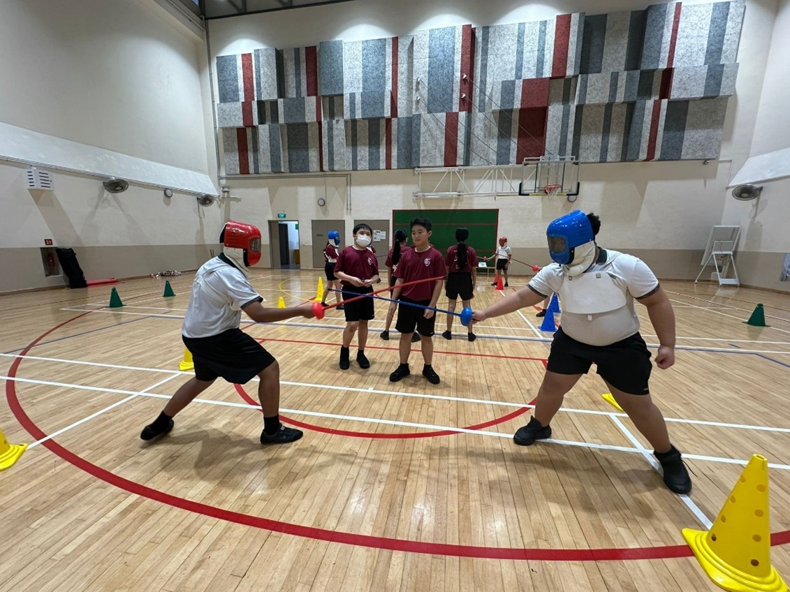 Our Primary 5 students participating in the Golf Sports Education Programme (Fencing)